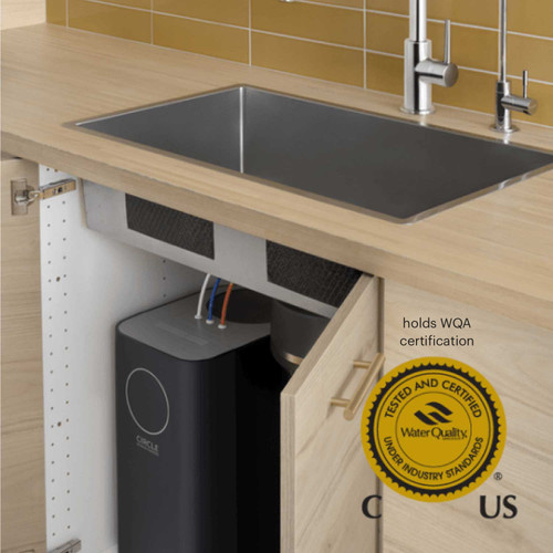 Brondell RC100 Circle reverse osmosis under counter water filter system installed under the counter sink with cabinet doors open holds the WQA certification