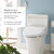 Brondell Swash DR802 bidet toilet seat installed on a standard toilet in a modern blue bathroom