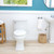 Brondell SouthSpa essential left-handed bidet attachment installed in modern bathroom with turquoise accent wall.