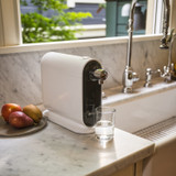 Cypress countertop water filtration system installed in a modern kitchen with small footprint on a marble countertop.