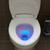 Brondell Lumawarm toilet seat equipped with blue nightlight displayed at night