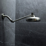 Nebia Adjustable Shower Arm Chrome with a chrome showerhead installed in a dark gray background