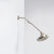 Nebia Adjustable Shower Arm Spot Resist Nickel with a showerhead installed in a center position with a white background